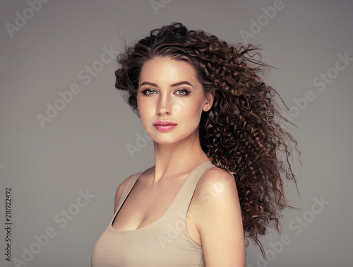 Beautiful hair long curly hairstyle woman with beauty makeup female model portrait