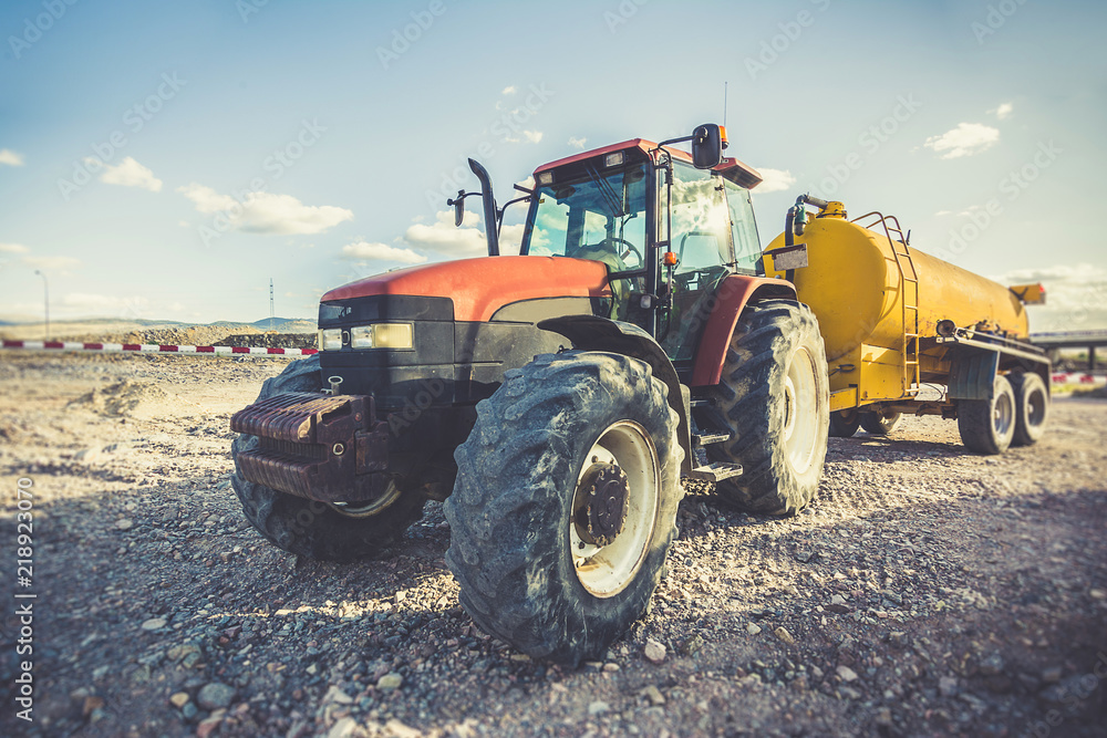 Tractor with a water tank for the transport of liquids Tractor with a water tank for the transport of liquids
