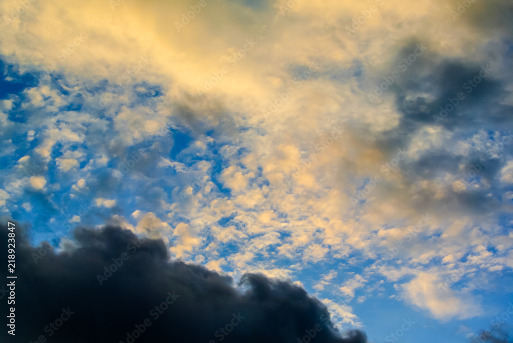 Clouds and sunset light in blue sky background