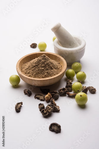 Amla powder with raw Avla, it's an Ayurvedic alternative medicine photo