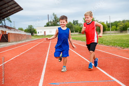kids running around at the sports stadium