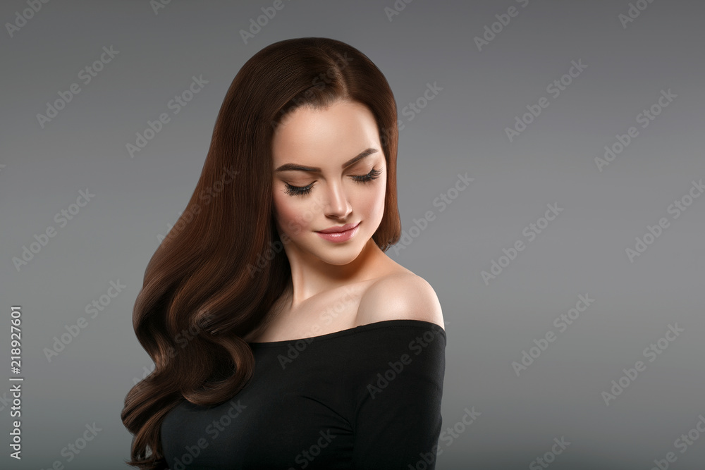 Brunette with perfect hair. Woman beautiful portrait with healthy long hairstyle curly and perfect. Brunette with perfect hair. Woman beautiful portrait with healthy long hairstyle curly and perfect.