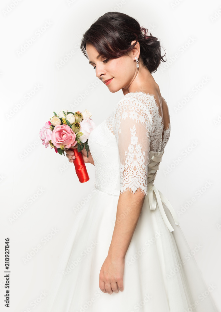 elegant bride with beautiful wedding bouquet in a hands. wedding make-up and hairstyle concept elegant bride with beautiful wedding bouquet in a hands. wedding make-up and hairstyle concept