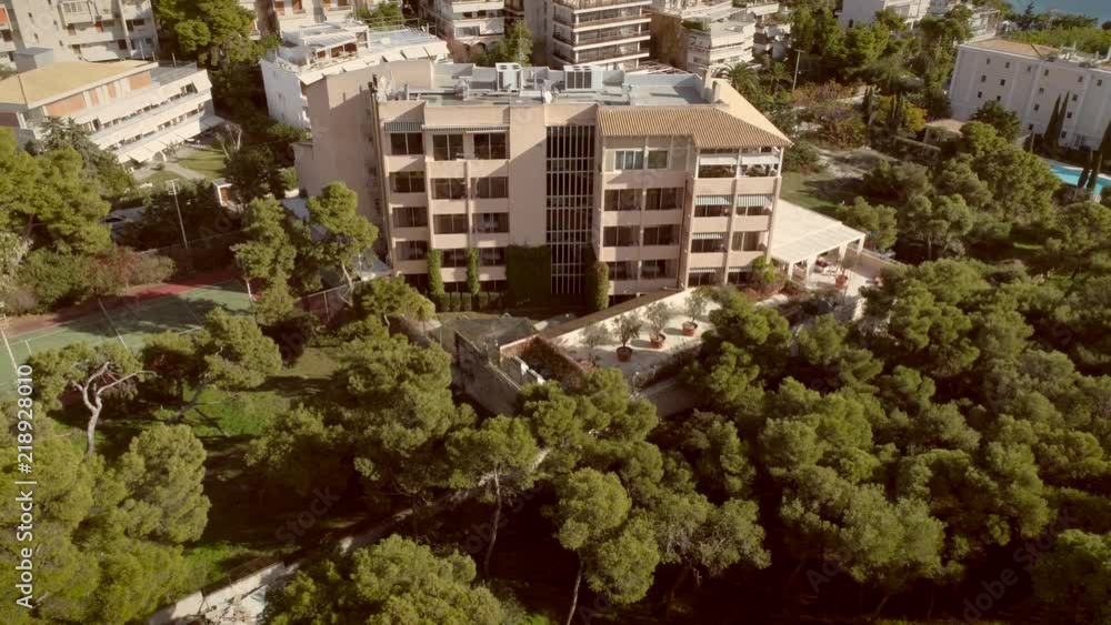 Aerial view of a residential building, surrounded by trees in Greece. Aerial view of a residential building, surrounded by trees in Greece.