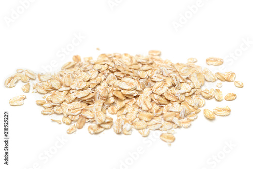 Dry rolled oatmeal on white background - isolated