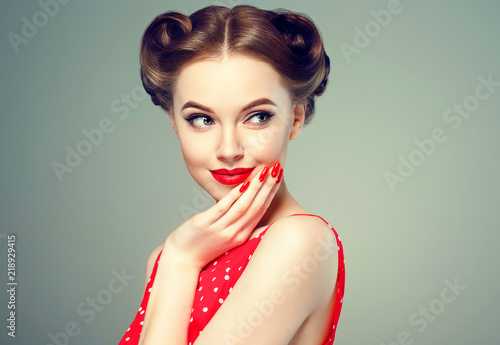 Pinup woman beauty portrait vintage retro girl model in polka dot dress