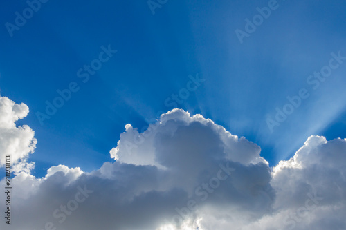 blue sky with sun light and clouds