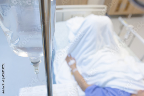 Female patients take saline intravenous in the hospital.- Health care concept