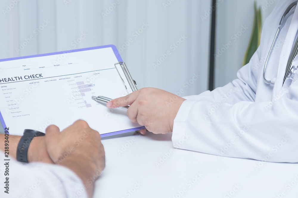 Doctor and patient are discussing something.- Health care concept Doctor and patient are discussing something.- Health care concept