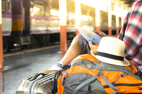 Traveler waiting for journey travel at train station. - Travel and transportation concept.