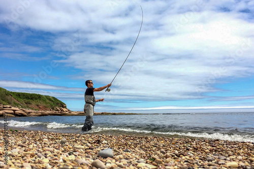 Saltwater fly fishing for Striped bass on Quebec's Gaspe Peninsula, Canada photo