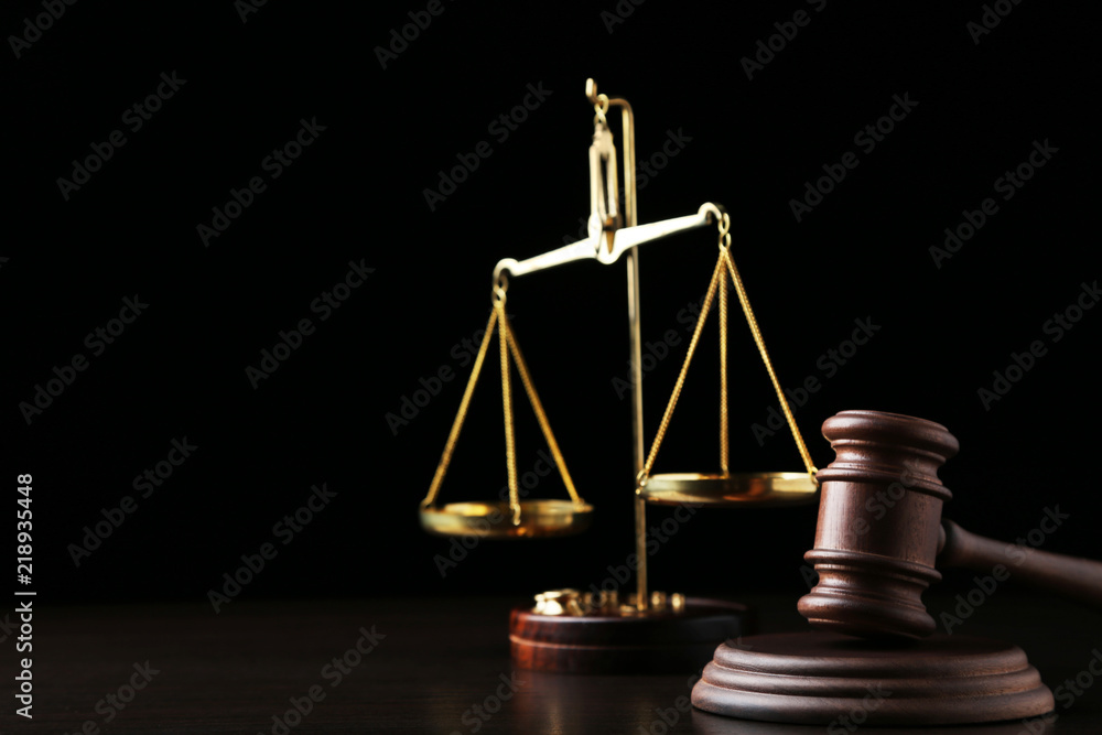 Judge gavel with scales on wooden table Judge gavel with scales on wooden table
