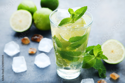 Mojito cocktail in glass on wooden table