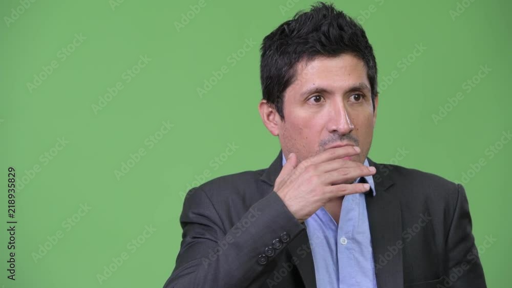 Hispanic businessman looking shocked Hispanic businessman looking shocked