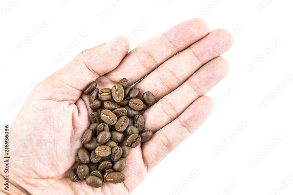 Coffee bean in hand isolated on white background Coffee bean in hand isolated on white background