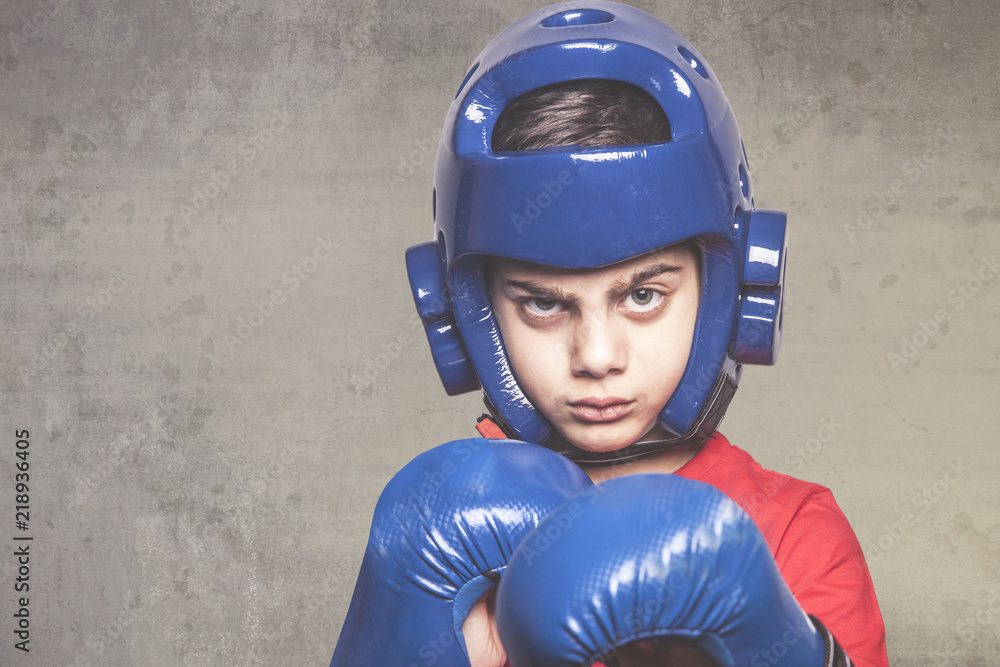 Determined little fighter. Martial arts concept Determined little fighter. Martial arts concept
