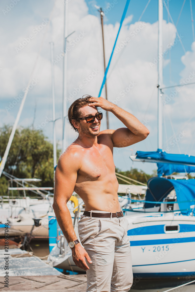 Sexy man on sailboat, relaxation in luxury sea cruise, summertime leisure  time on water transport, freedom and enjoyment concept – Stock-Foto | Adobe  Stock