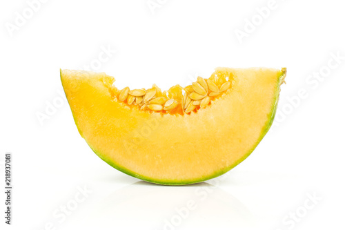 One slice of fresh melon cantaloupe variety isolated on white background