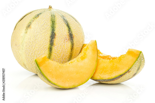 Group of one whole two slices of fresh melon cantaloupe variety without seeds isolated on white background