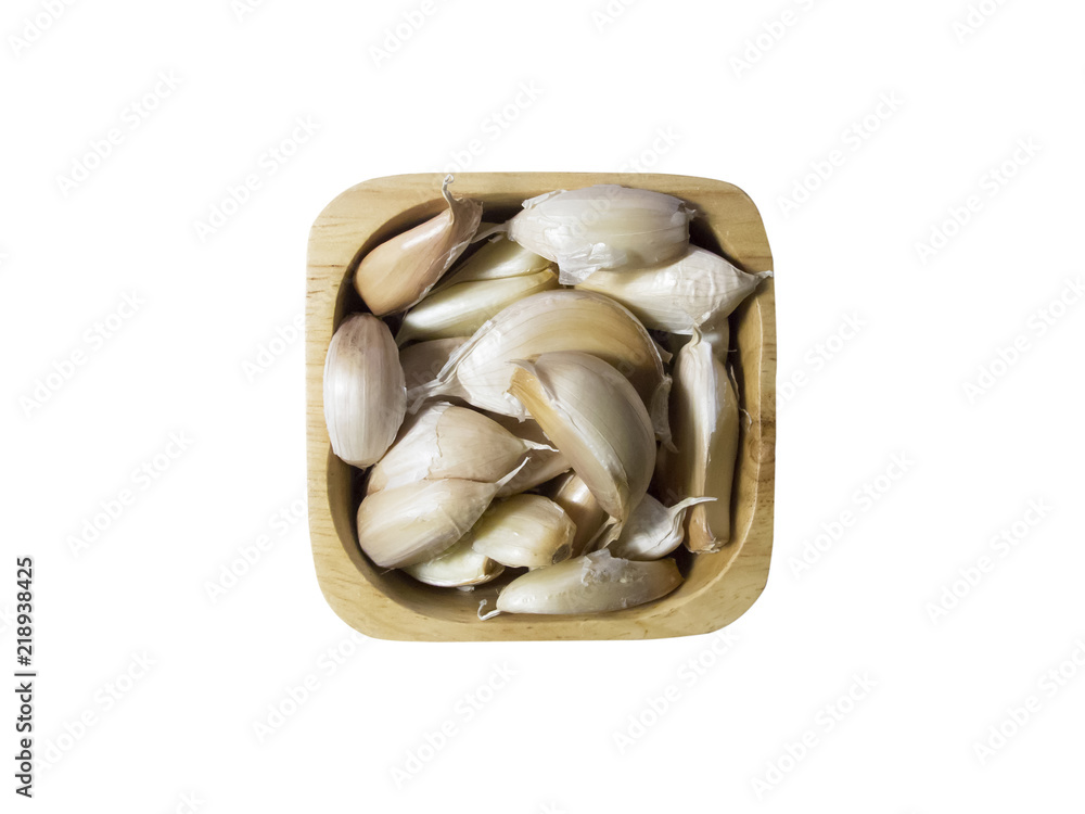 Top view Garlic in a wooden bowl on white background Top view Garlic in a wooden bowl on white background