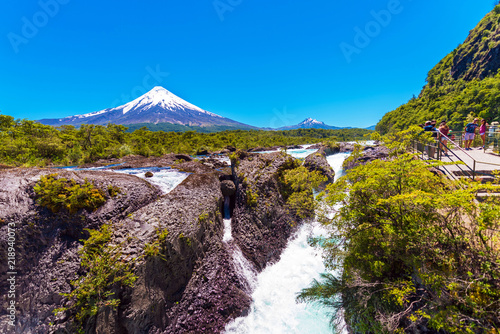 Salutos de Petrohue waterfalls and volcano Osorno, Puerto Varas, Chile. Copy space for text. photo