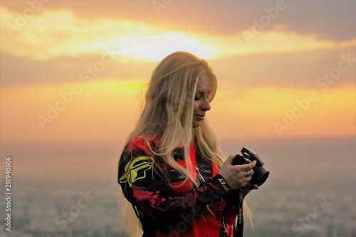 photo of Olga Zaitseva on the wather tower, against sunset photo