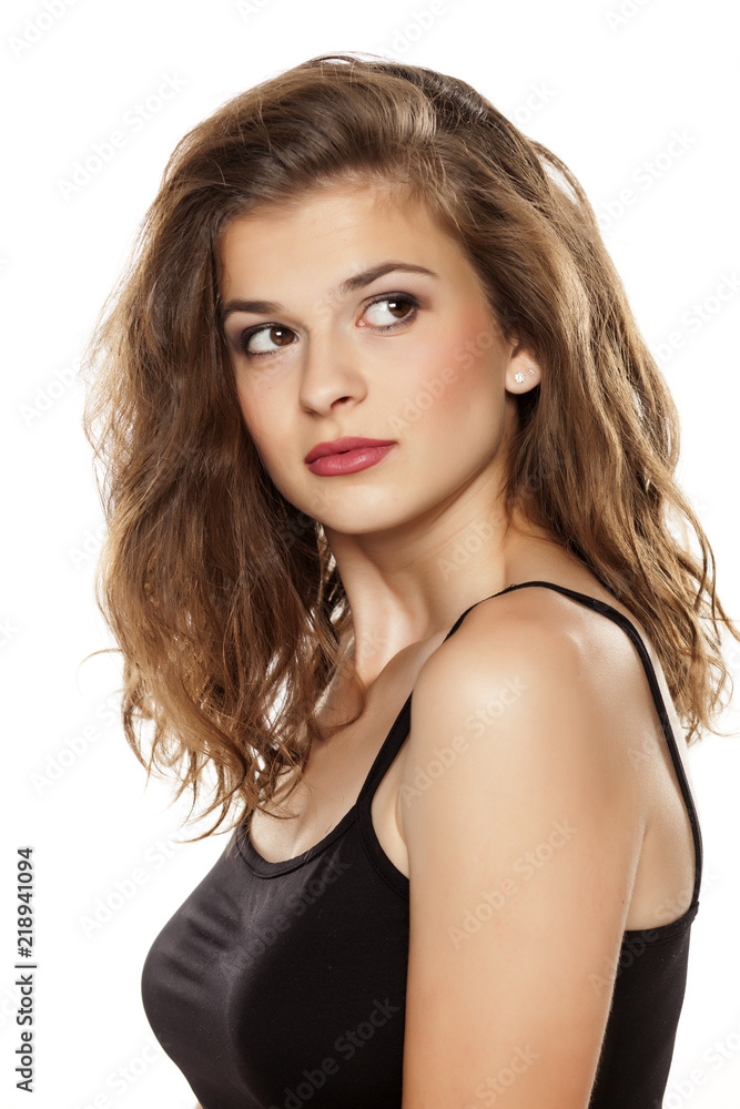 Portrait of young beautiful woman with long curly hair on white background Portrait of young beautiful woman with long curly hair on white background