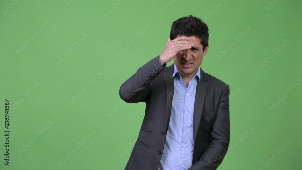Hispanic businessman not wanting to see something Hispanic businessman not wanting to see something
