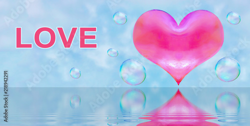 a heart-shaped soap bubble. blue sky background with clouds. the reflection in the water. red heart. inscription love photo