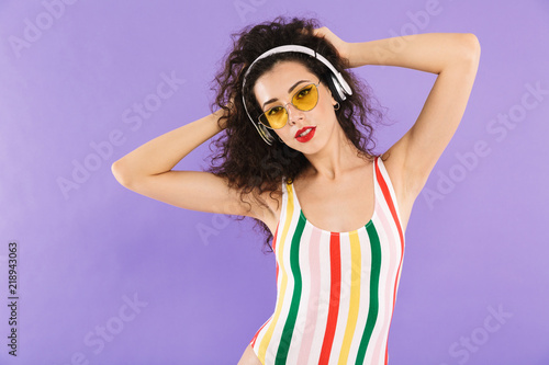 Portrait of a beautiful young woman dressed in swimsuit