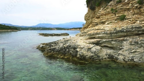 Desimi Beach Golf and nearby Island with clear water in Greece photo