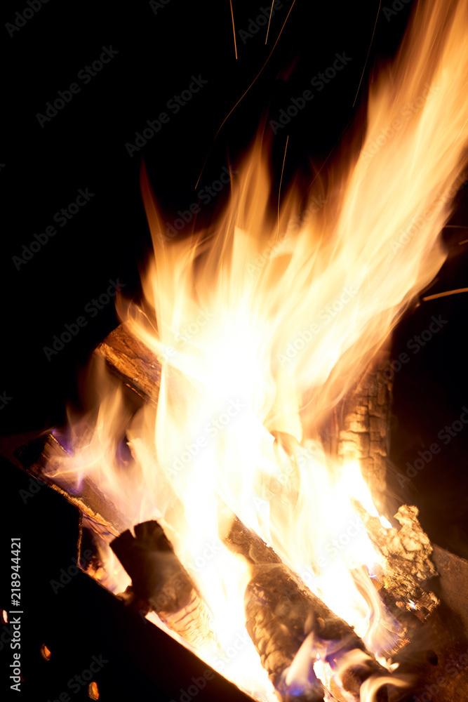 Fire flames on a black background. The fire burns on a black background. Fire flames on a black background. The fire burns on a black background.
