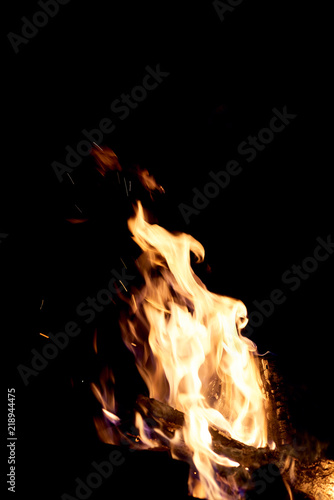Fire flames on a black background. The fire burns on a black background. © zhekkka