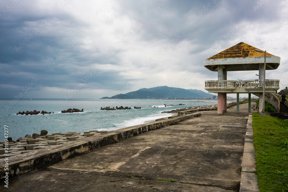 Pavilion on seashore with breakwater and stormy weather over pacific ocean in Hualien Taiwan Pavilion on seashore with breakwater and stormy weather over pacific ocean in Hualien Taiwan