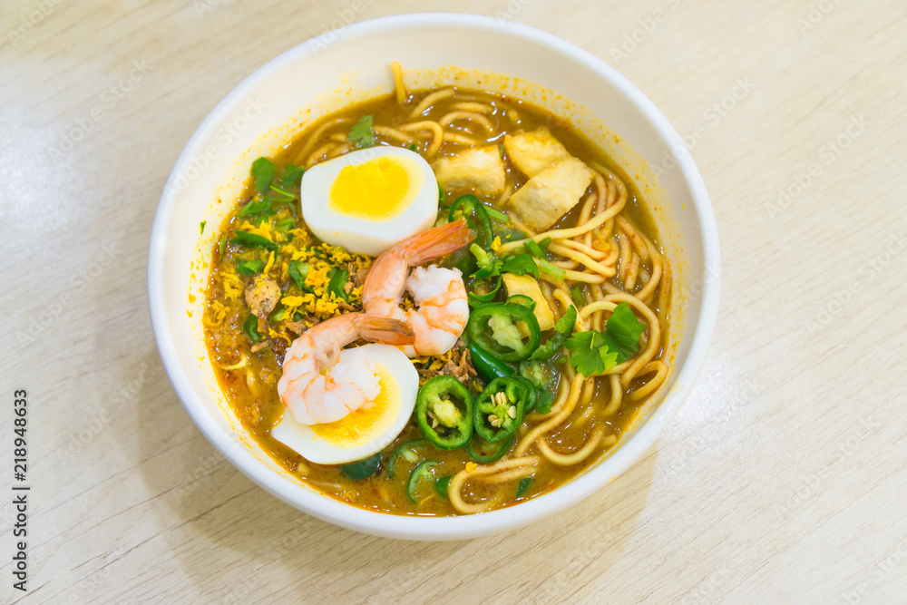 Laksa noodles is a spicy soup popular in Singapore local delicious food