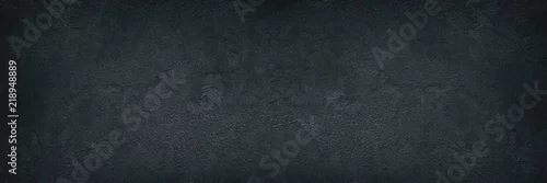 Obraz  z motywem Black rough concrete wall wide texture - dark grunge background