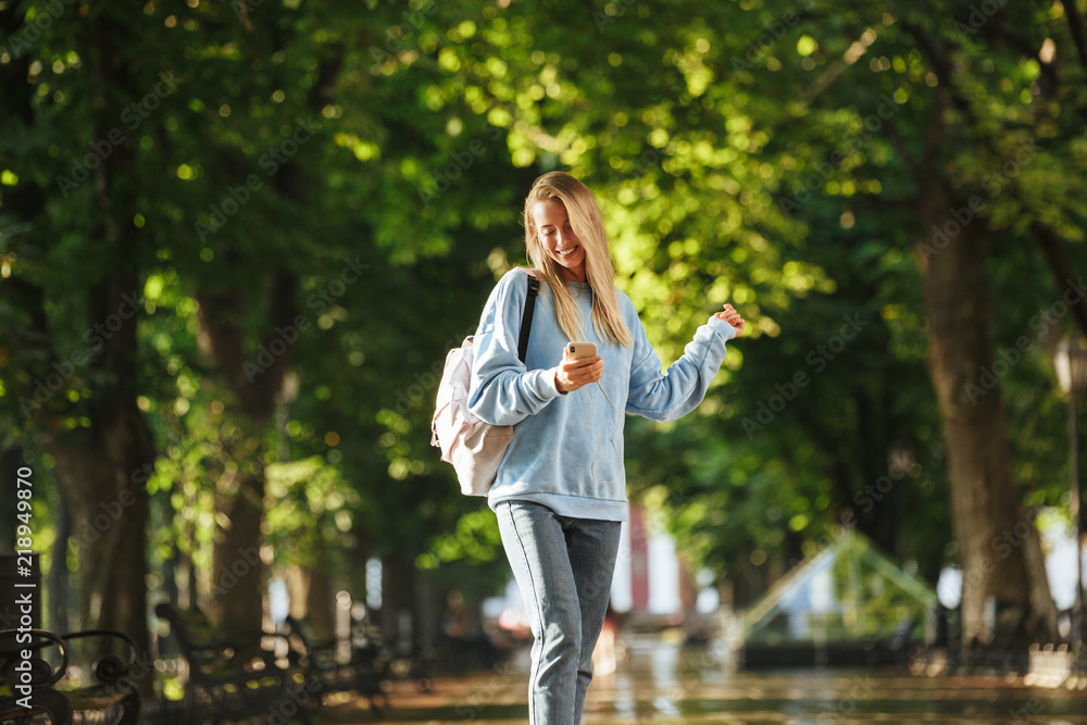 Cheerful young girl student with backpack Cheerful young girl student with backpack