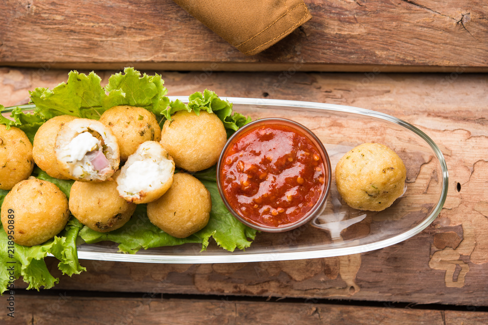Dahi Ke Angare also known as Kabab or kebab is a popular snack item from India / Pakistan. served with green and red sauce. Selective focus Dahi Ke Angare also known as Kabab or kebab is a popular snack item from India / Pakistan. served with green and red sauce. Selective focus