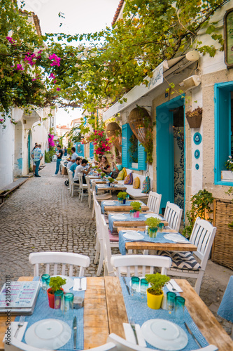 Streets of Alacati Turke with cozy colorful restaurants photo