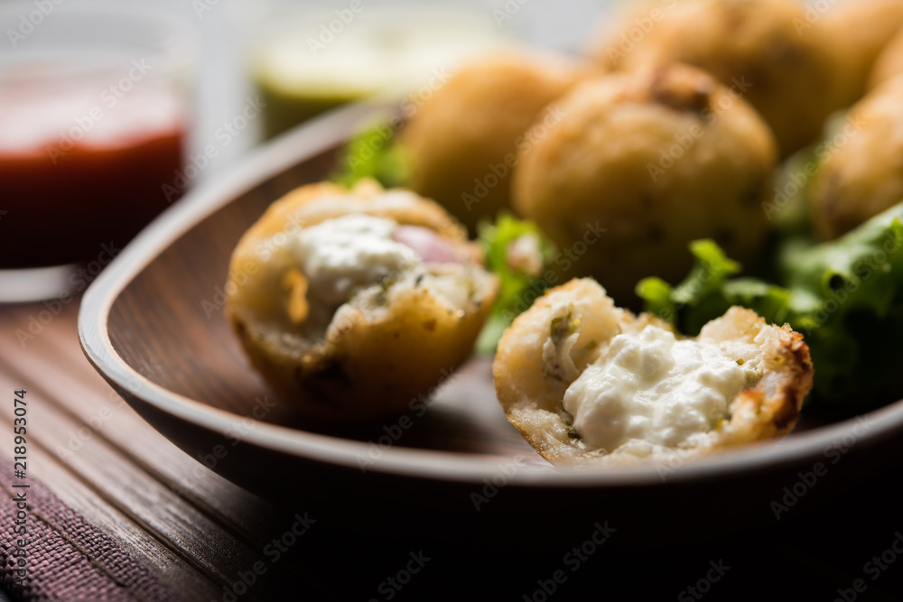 Dahi Ke Angare also known as Kabab or kebab is a popular snack item from India / Pakistan. served with green and red sauce. Selective focus