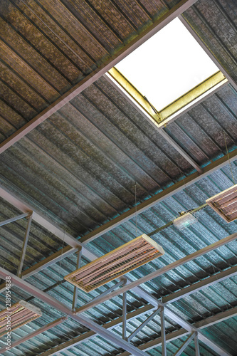 View on the ceiling of an industrial building with lamps. © Spectral-Design