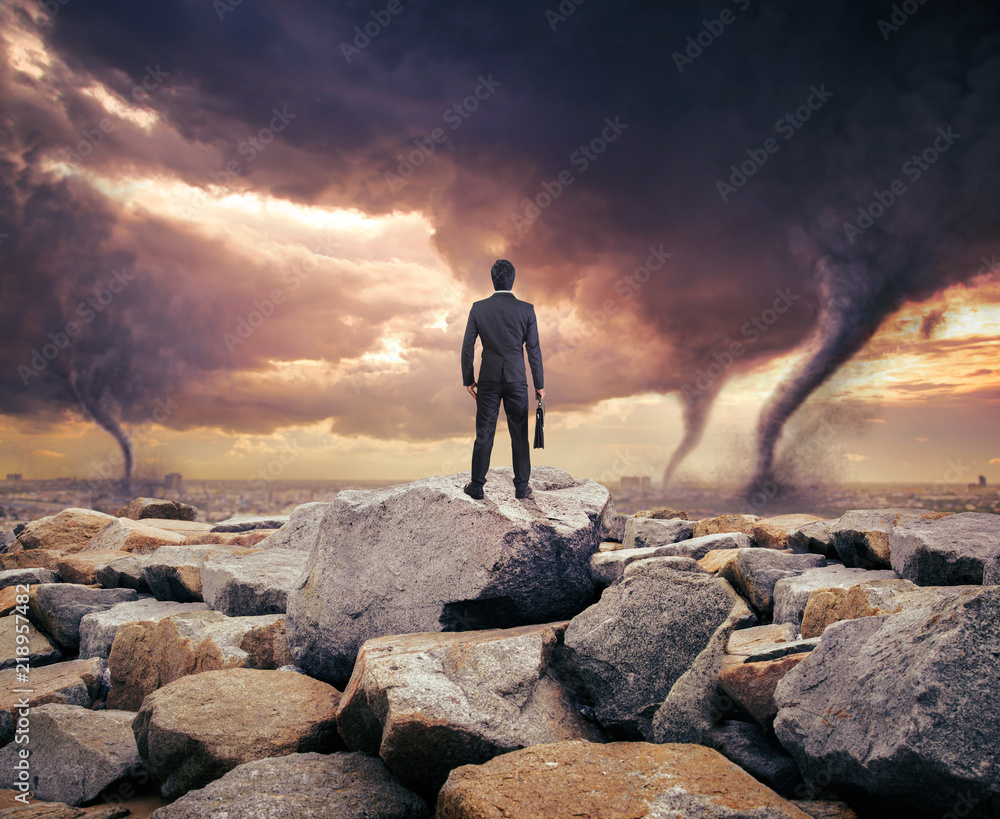 Businessman watching a tornado. Concept for success. Businessman watching a tornado. Concept for success.