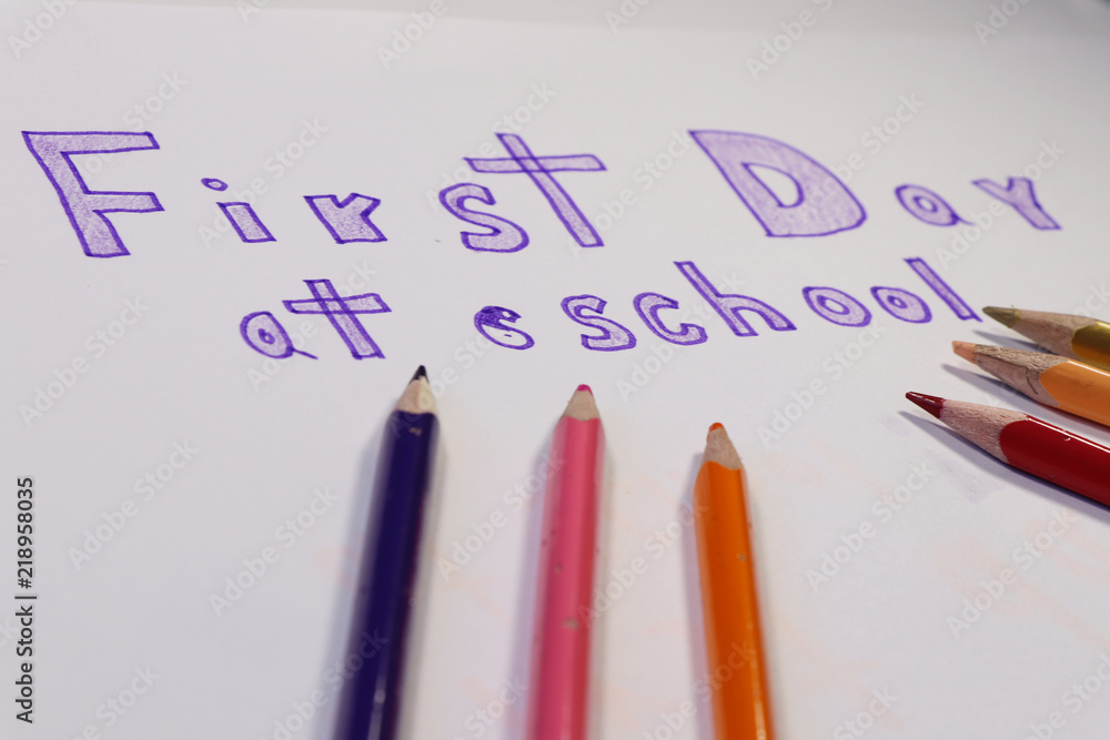 View on inscription First day at school. Beginning for many kids. Colourful pencils View on inscription First day at school. Beginning for many kids. Colourful pencils