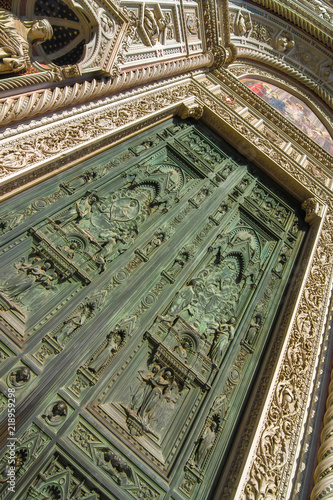 View on the main entrence of the Cathedral of Santa Maria in Florence, Italy on a sunny day. photo