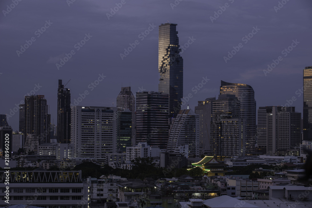 City scape of Bangkok business building and hotel in the sunset time.