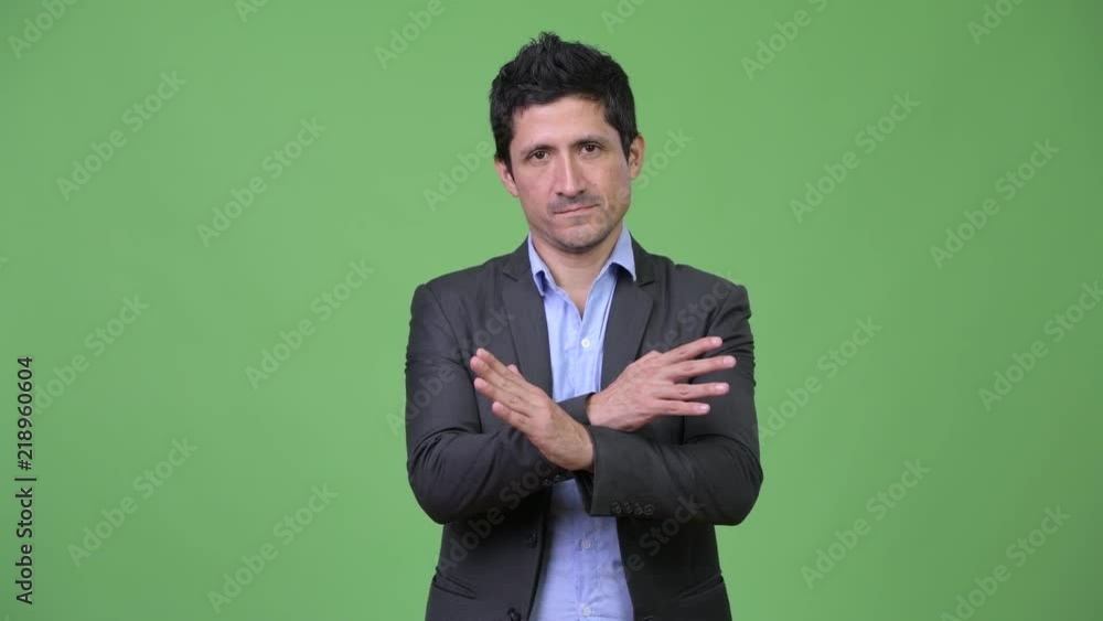 Hispanic businessman with stop gesture
