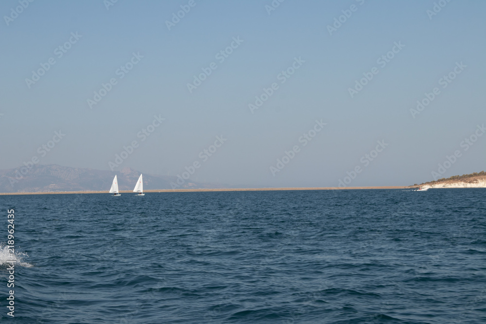 Fototapeta premium Two boats in the open sea