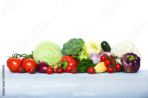 Fresh vegetables on wooden background.
