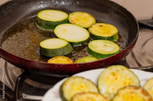 Fried in oil vegetable marrows in the kitchen