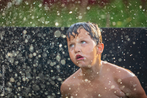 Portrait of a boy bathing in the pool